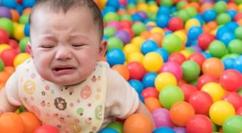 child in ball pit