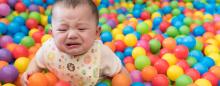 child in ball pit